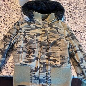 Camouflage women’s Jacket with Faux Fur Hood. Very fitted.